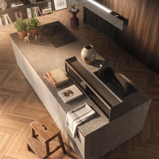 Dark Arrital island with an integrated sink and open storage beneath the worktop.