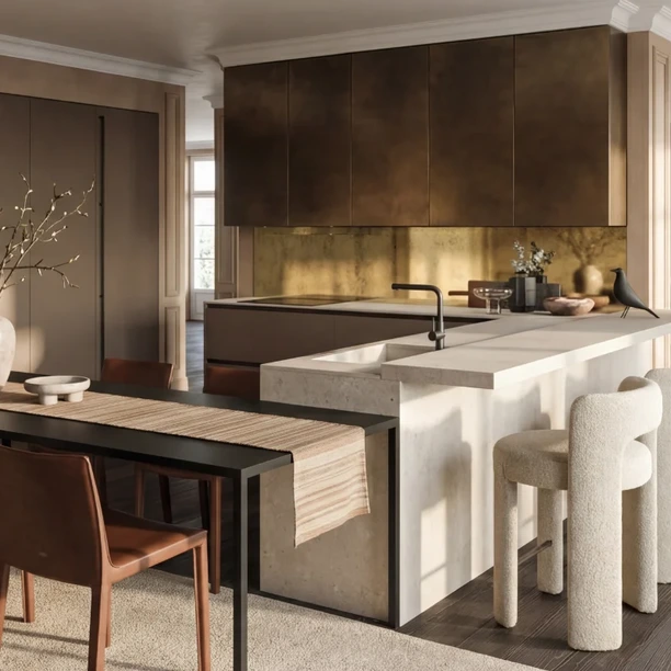 L-shaped Arrital kitchen with a brass splashback, pale island and dining seating.