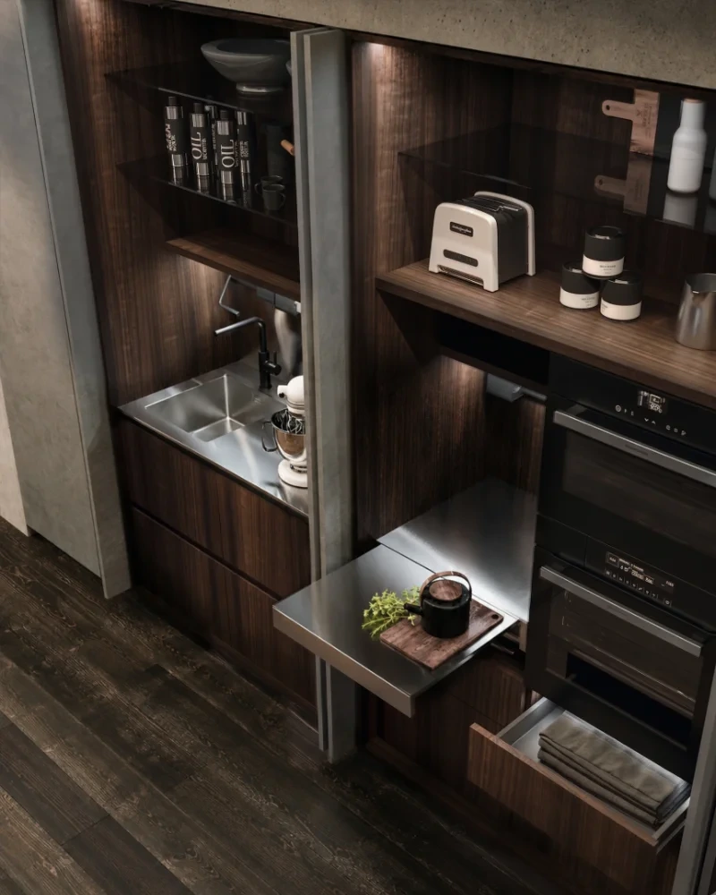 Tall Arrital cabinetry with pocket doors open to reveal a concealed sink and appliance area.