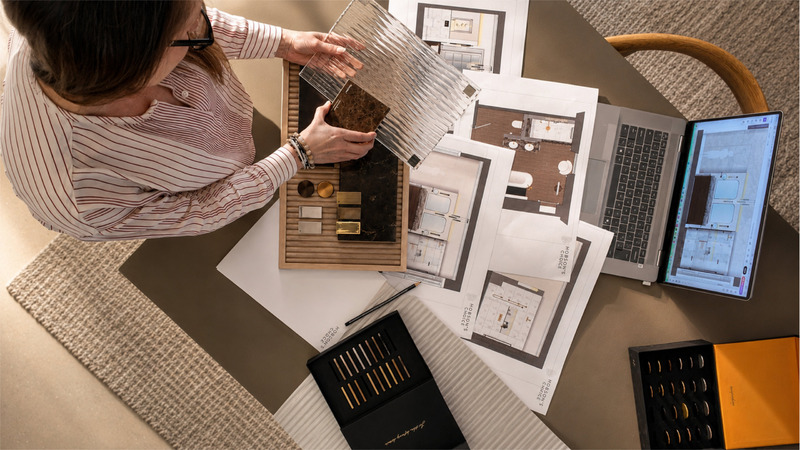 Hobson’s Choice designer reviewing bathroom material and finish samples