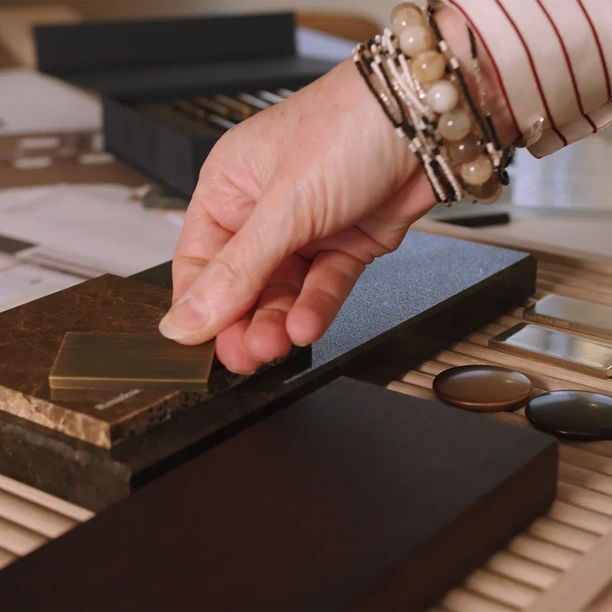 Hobson’s Choice designer arranging kitchen and interior material samples