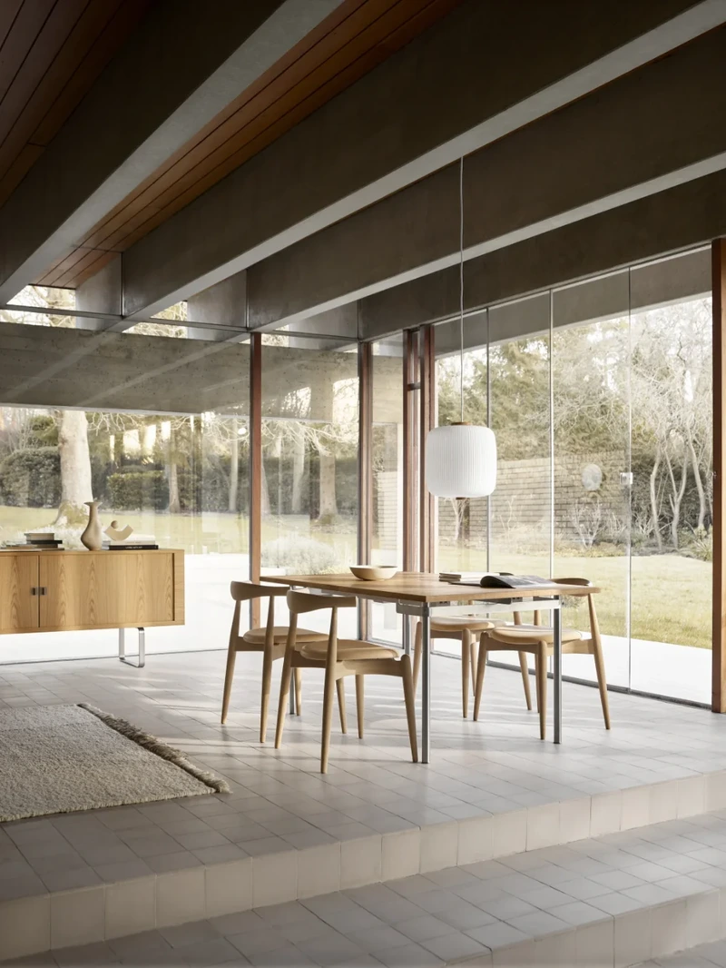 Carl Hansen & Søn dining chairs arranged around a timber dining table