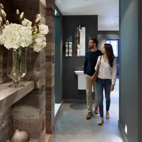 A couple walk through Hobson's Choice design studio in Swindon exploring the Bathroom room sets