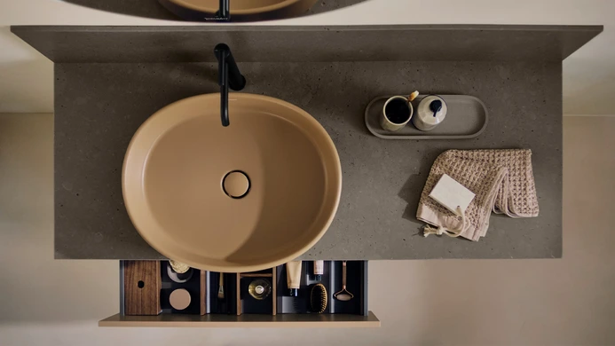 A top down view of a bathroom sink and vanity top