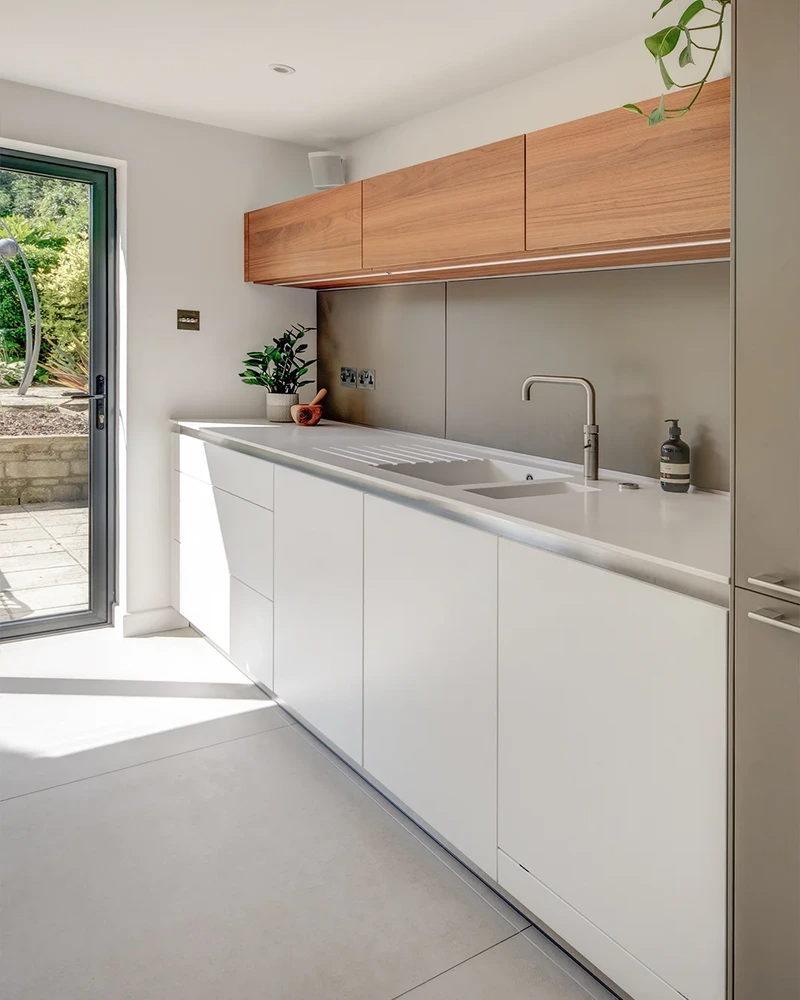 Alpine White Kitchen With Walnut Accents 19