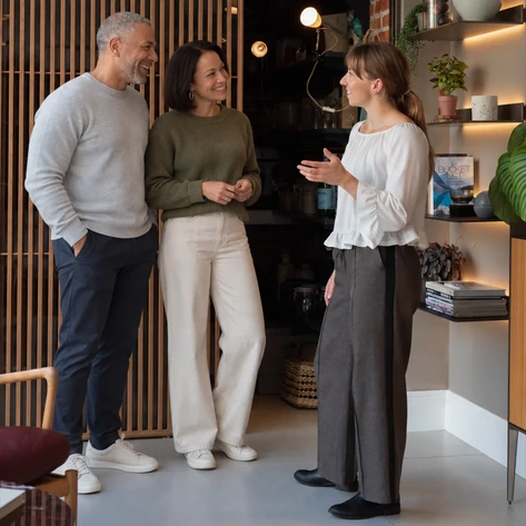 Kitchen Designer Chatting With Clients