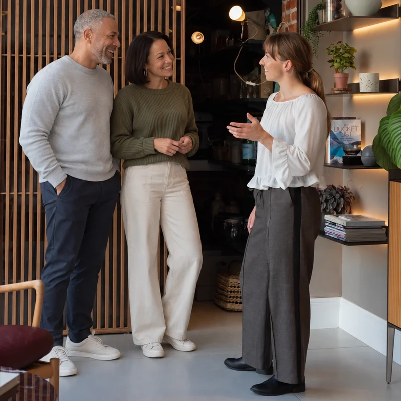 Kitchen Designer Chatting With Clients
